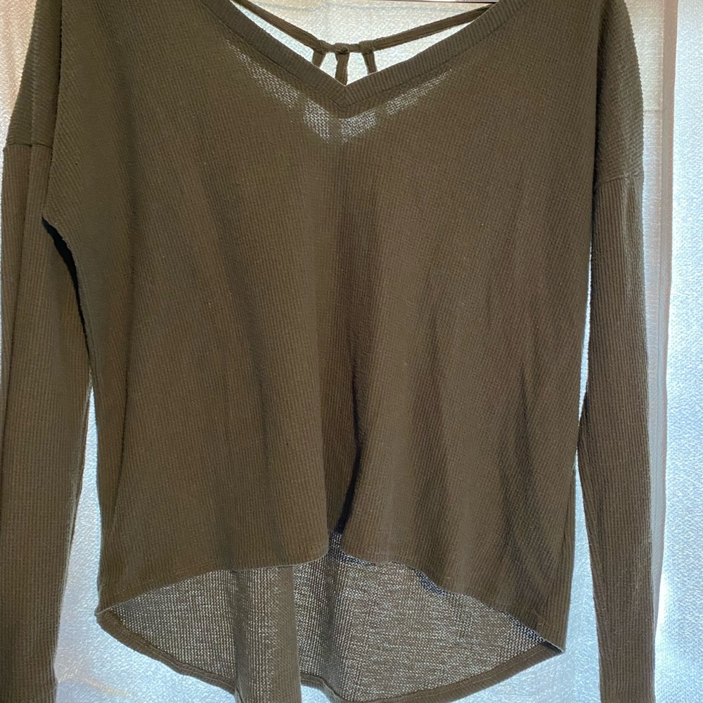 Liberty love size medium dark green high low sweater. Crossed pattern in back.